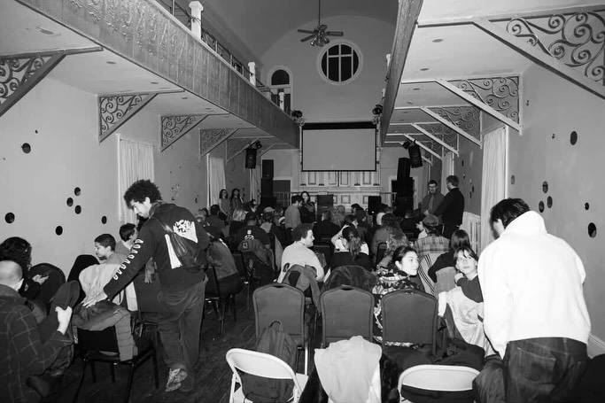 Audience filling the Brooklyn Peace Center for Alcove Cinema's first screening